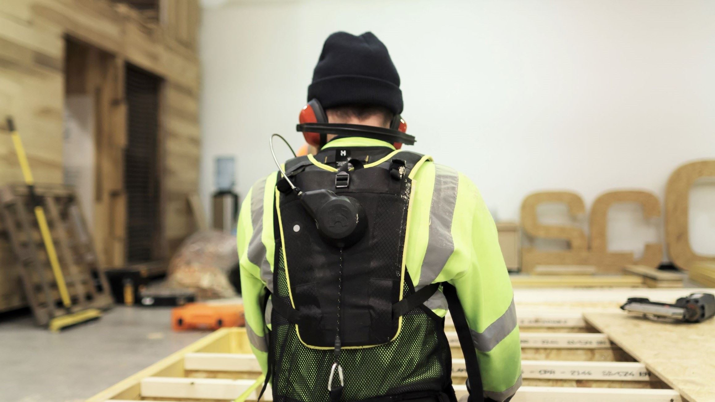 Construction worker using exoskeleton